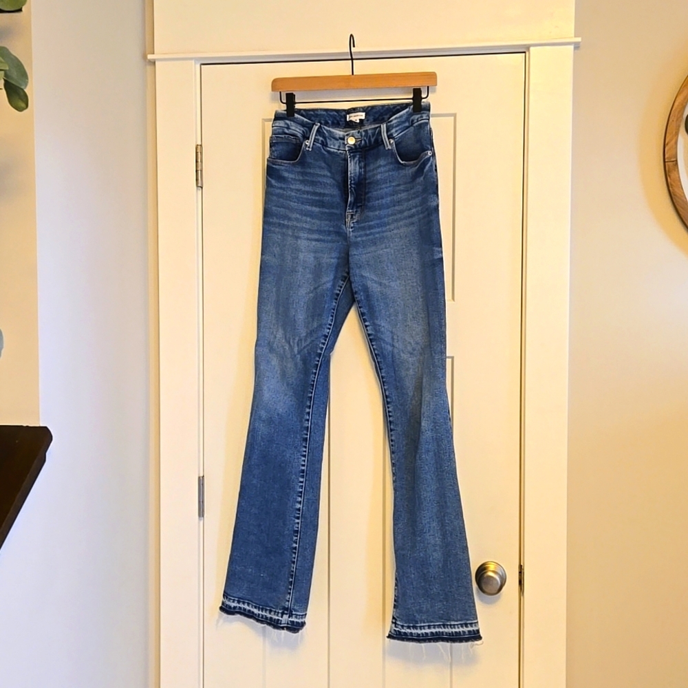 Good American raw hem flare jeans